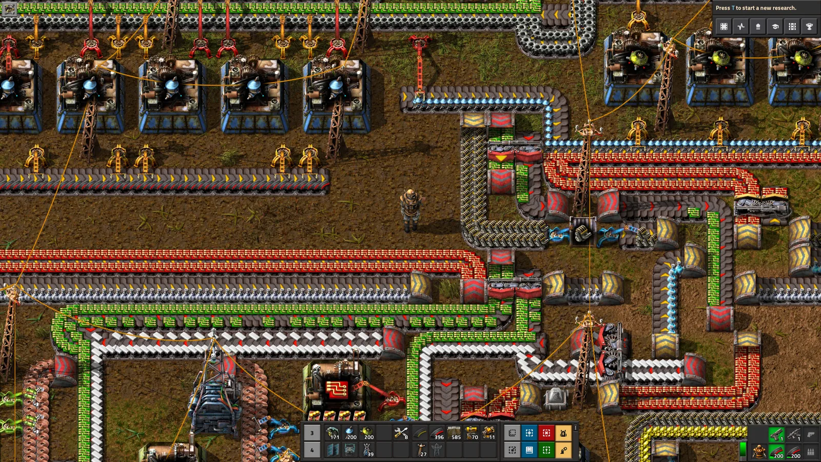 Dense Factorio conveyor belts carrying several resources through assemblers